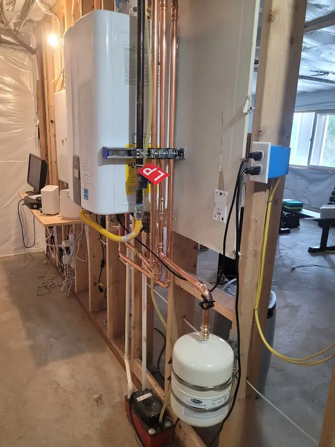 Licensed plumber repairing a kitchen sink in Moriah